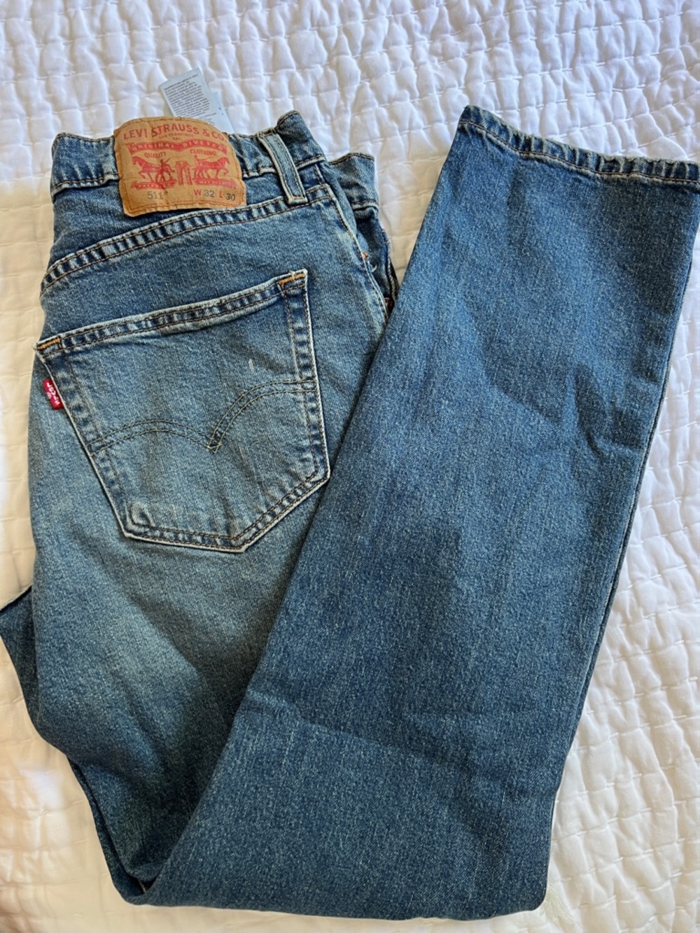 Levi's Men's Medium Blue Straight-Leg Jeans with holes in front